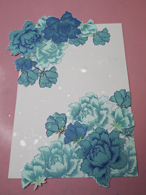 Altanew turquoise flowers layered on journaling page with silver paint splotches