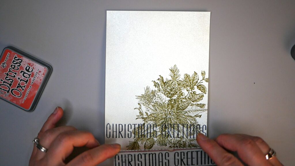 Stamping Christmas Greetings on Card