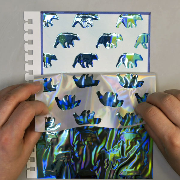 Removing Deco Foil Glass Slipper from Journal Page to reveal Wild Whisper Designs bear image