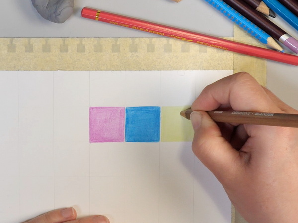 Adding squares of colored pencil to art journaling page