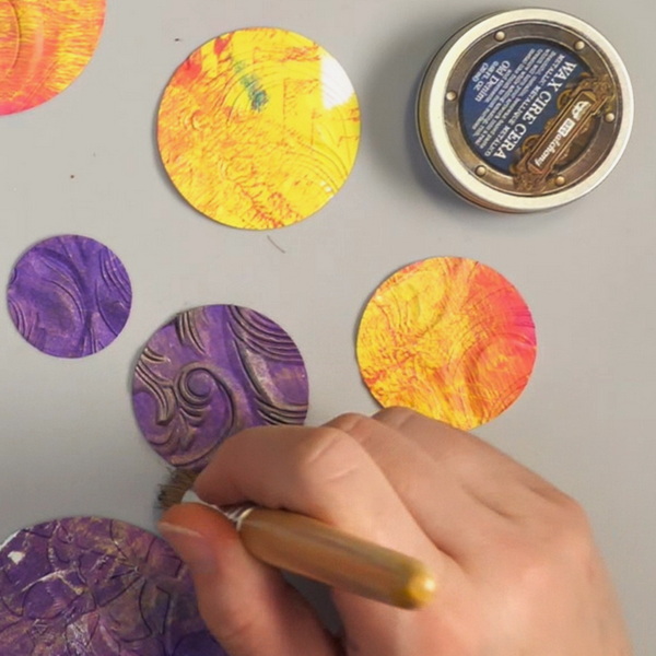 Brushing Art Alchemy Metallique Waxes onto Embossed Gelli Prints