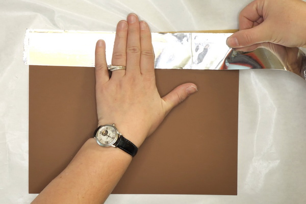 Adding foil ducting tape to paper to create greeting cards