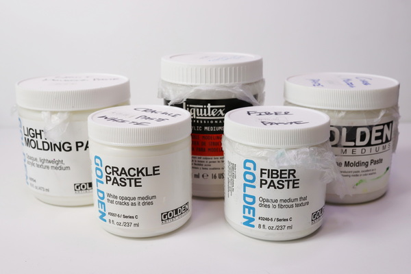 Different professional artists acrylic pastes that are available. Golden Light Molding Paste, Crackle Paste, Fiber Paste, Coarse Molding Paste and Liquitex Flexible Modeling Paste