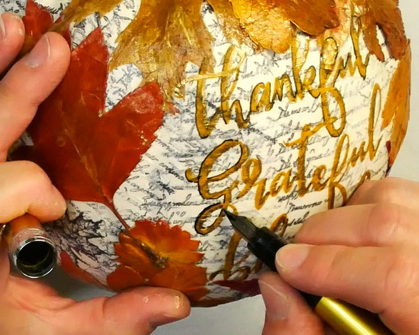 Adding Black Contrast to Decoupaged Napkin Image on Plastic Pumpkin using Plaisir Platinum Fountain Pen and Carbon Ink