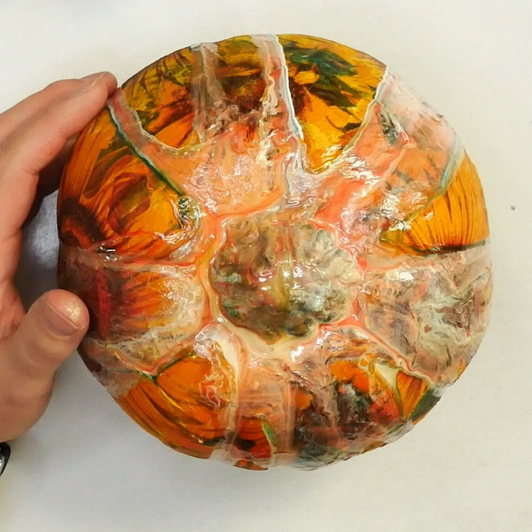 Dried Paint pour on a plastic pumpkin with napkin decoupage