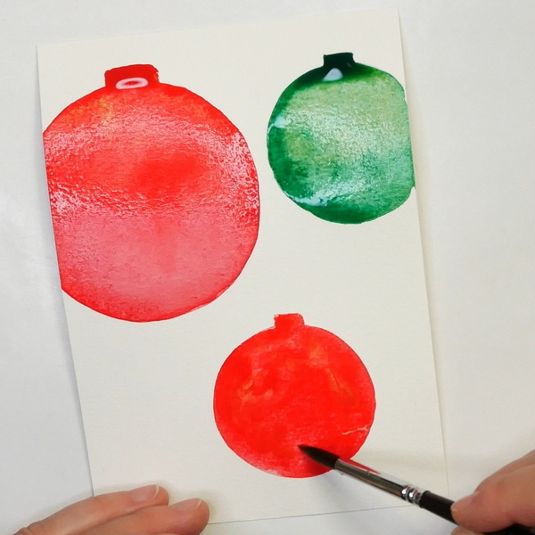 Simple watercolor Christmas cards blending red watercolor paints
