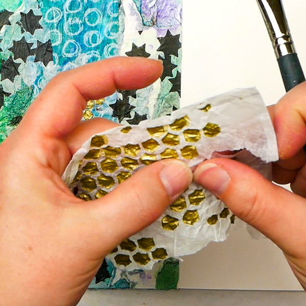 Tearing tissue paper with crackle paste medium