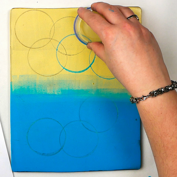 Mark Making on a gel plate with a plastic container