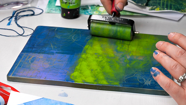 Adding a second layer of paint to a gel plate print
