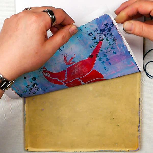 Pulling a 3 layer gel print from a Gelli Arts Printing Plate