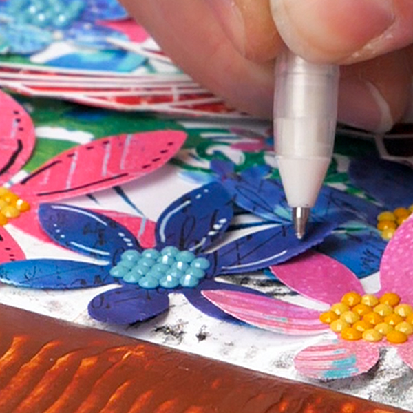 Adding white doodles with Posca Paint Pens to die cut flowers