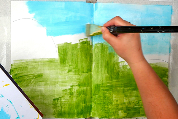 Adding a base layer of acrylic paint before creating textured collage background