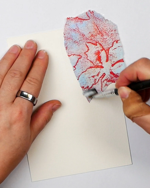 Adding Liquitex Matte Medium to the top of collage paper