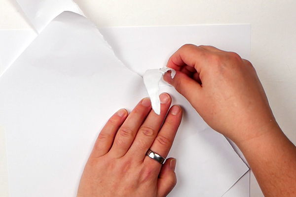 Ripping a paper mask to create cloud images