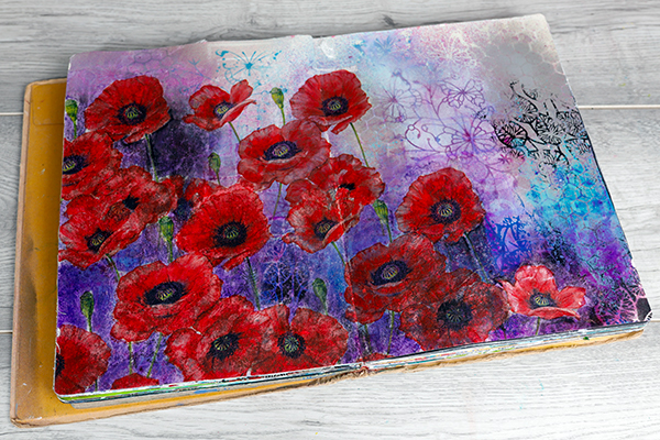 Open flat stitched art journal by Dylusions. Artwork by Nadine Milton of Hop-A-Long Studio