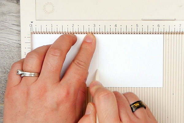 Scoring paperclip cover on score board