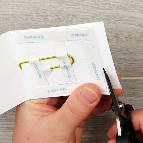 Trimming edge of paperclip cover