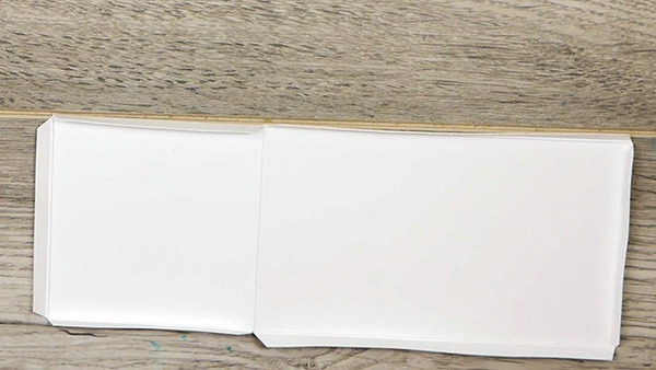 Folded interior cover for covered art paperclip