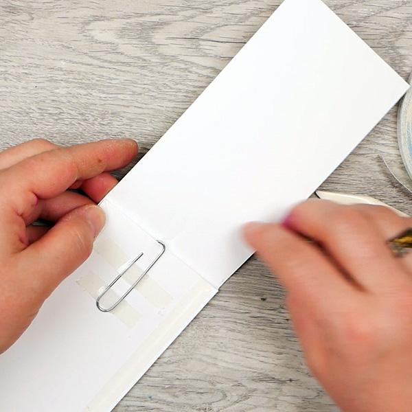 Creating a paperclip art bookmark- folding the front cover