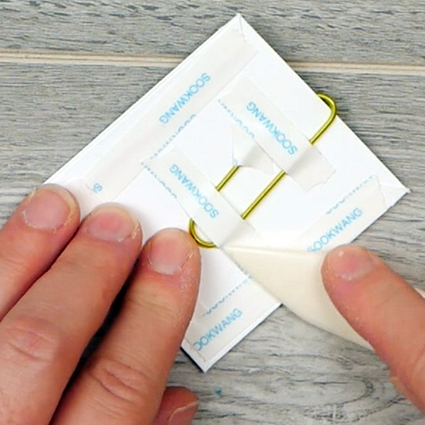 Burnishing sookwang tape on the covered paperclip